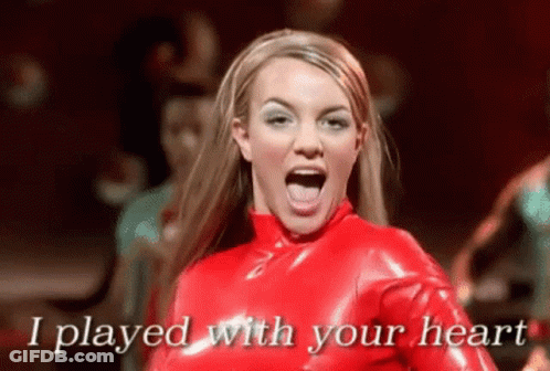Britney Spears Is Wearing A Red Latex Outfit And Singing I Played With Your Heart . GIF