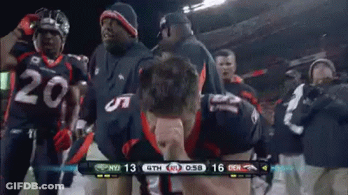 Broncos Football Players Celebrating On Sidelines GIF