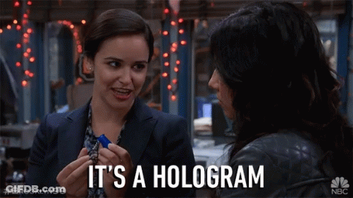 Brooklyn 99 Two Women Talking It's A Hologram GIF