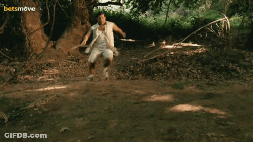 Brown Dog Standing On Hind Legs Behind White Table GIF