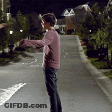 Brown Jacket Man Looking At Camera With Woman GIF