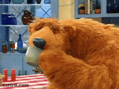 Brown Teddy Bear Drinking Coffee At Table GIF