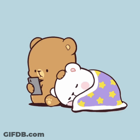 Brown Teddy Bear Looking At Cell Phone Next To White Teddy Bear Under Star Blanket GIF