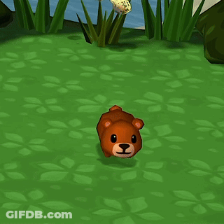 Brown Teddy Bear Sitting On Grass GIF