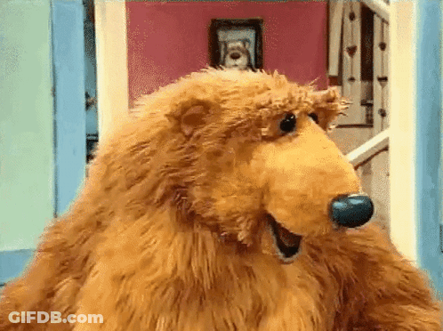 Brown Teddy Bear With Blue Nose Standing In Front Of Door GIF