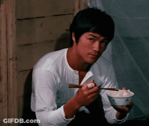Bruce Lee Eating Rice With Chopsticks GIF