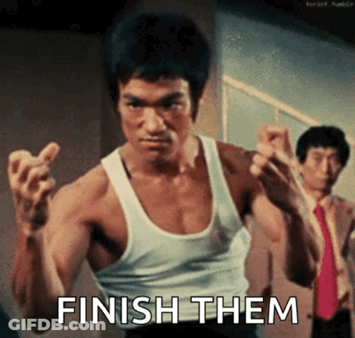 Bruce Lee In White Tank Top Making Fist Saying Finish Them GIF