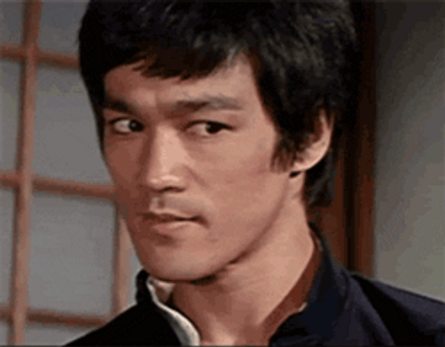 Bruce Lee Pissed Smirk GIF