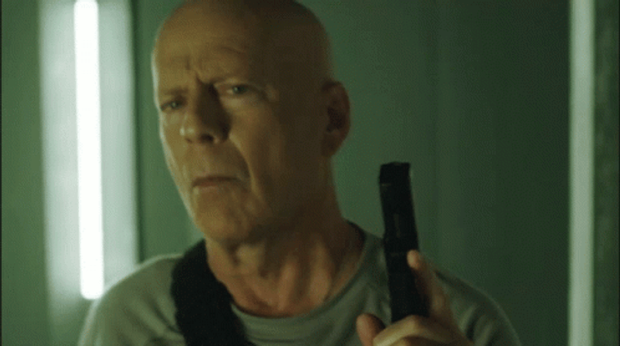 Bruce Willis Holding A Gun GIF