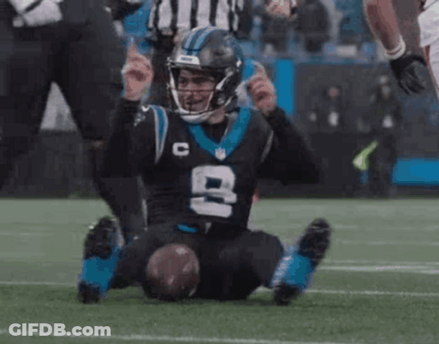 Bryce Young Sitting Cool On The Ground GIF