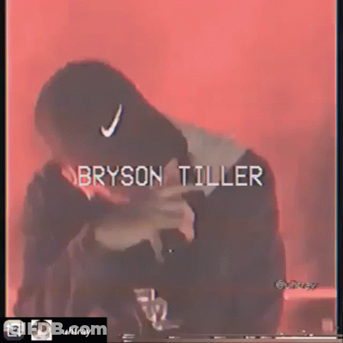 Bryson Tiller In Black Hat With White Nike Logo GIF