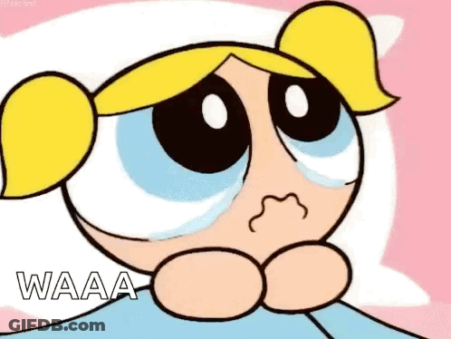 Bubbles From The Powerpuff Girls Is Crying While Sitting On A Bed . GIF