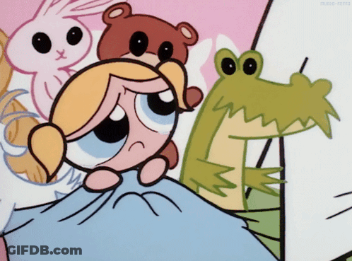 Bubbles From The Powerpuff Girls Is Laying On A Bed GIF