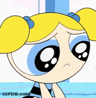 Bubbles From The Powerpuff Girls Is Sitting Down With A Sad Expression On Her Face GIF