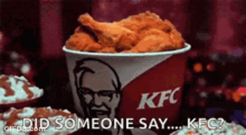 Bucket Of Fried Chicken Next To KFC Sign GIF