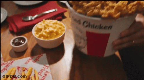 Bucket Of Fried Chicken On Wooden Table GIF