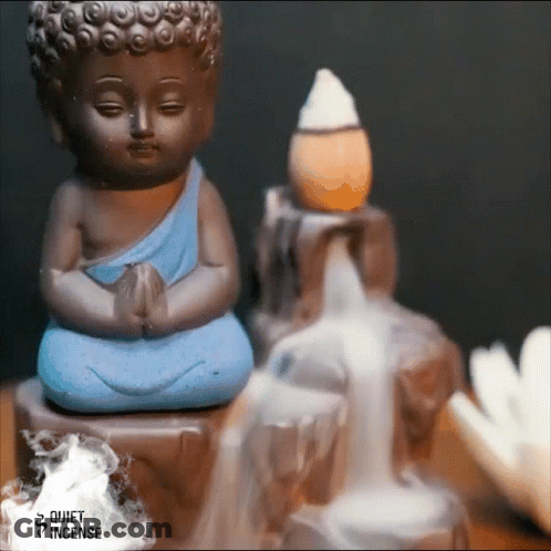 Buddha Statue Next To Waterfall And Incense Burner GIF