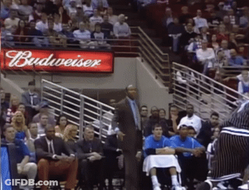 Budweiser Sign Above Crowd Watching Basketball GIF