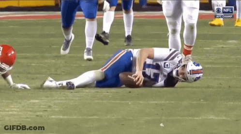 Buffalo Bills Player Laying On Ground Holding Football GIF
