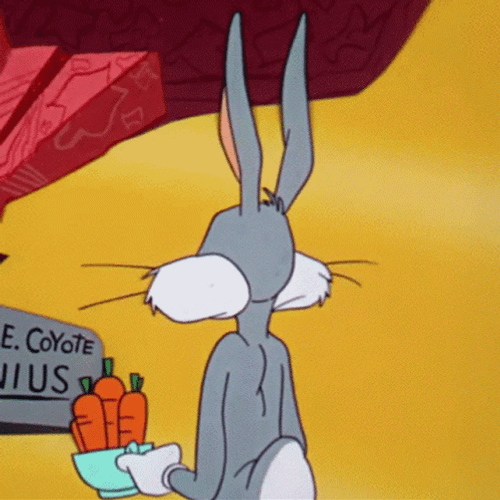 Bug Bunny Looking Behind Holding Its Carrots GIF