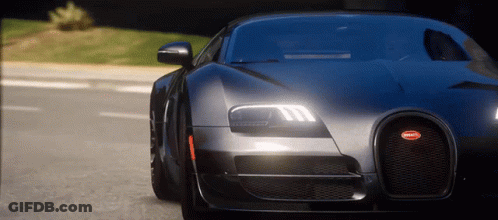 Bugatti Driving Down Street At Night GIF