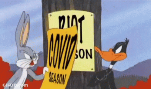 Bugs Bunny And Daffy Duck Standing Next To Dirty Season Sign GIF