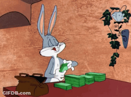 Bugs Bunny At Table With Money And Briefcase GIF
