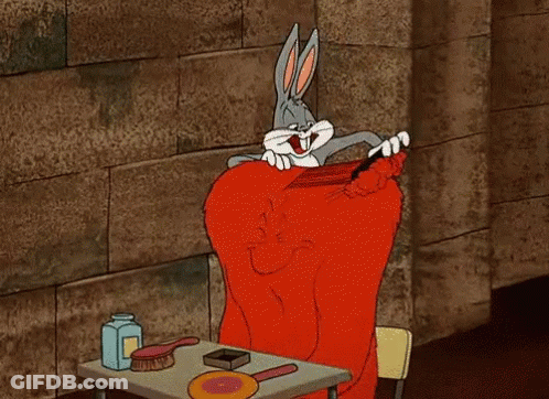 Bugs Bunny Brushing Hair At Table With Brushes And Lotion GIF