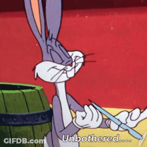 Bugs Bunny From Looney Tunes Is Holding A Knife And Says " Unbothered " GIF