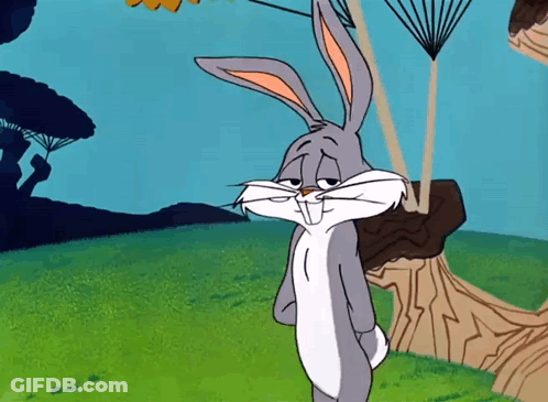 Bugs Bunny From Looney Tunes Is Standing In A Field GIF