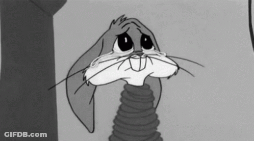 Bugs Bunny Is Crying In A Black And White Cartoon While Holding A Spring . GIF