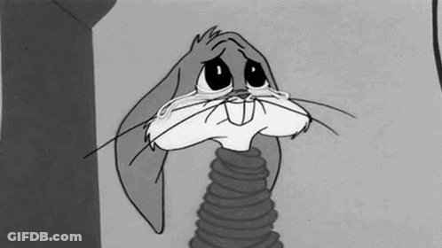 Bugs Bunny Is Crying In A Black And White Cartoon With A Slinky Around His Neck . GIF