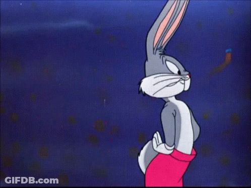 Bugs Bunny Is Flexing His Muscles In A Cartoon GIF