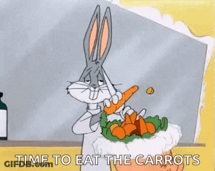 Bugs Bunny Is Holding A Carrot In His Mouth While Eating A Carrot Salad . GIF