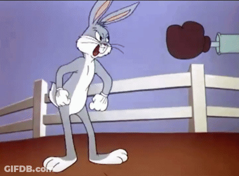 Bugs Bunny Is In A Boxing Ring With A Boxing Glove GIF