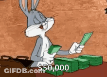 Bugs Bunny Is Sitting At A Table Holding A Bunch Of Money In His Hands . GIF