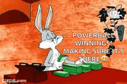 Bugs Bunny Is Sitting At A Table Holding A Stack Of Money And Making Sure It Is There . GIF