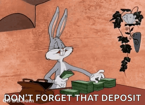 Bugs Bunny Is Sitting At A Table With A Stack Of Money And A Bag Of Money . GIF