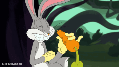 Bugs Bunny Is Smiling While Holding A Carrot In His Hand GIF