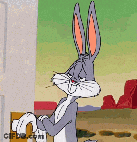 Bugs Bunny Is Standing In Front Of A Door And Looking At The Camera GIF