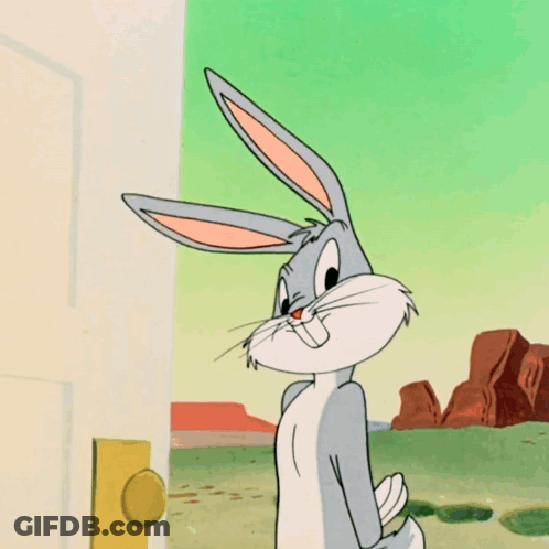 Bugs Bunny Is Standing In Front Of A Door With His Mouth Open GIF