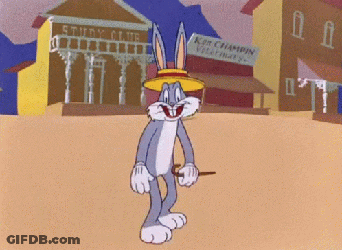 Bugs Bunny Is Standing In Front Of A Ken Champin Veterinary GIF