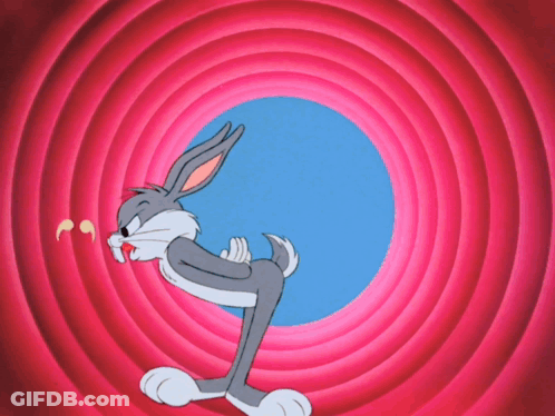 Bugs Bunny Is Standing In Front Of A Pink And Blue Circle With The Letter J On It GIF