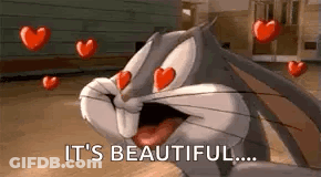 Bugs Bunny Is Surrounded By Hearts And Says `` It 'S Beautiful ... '' . GIF
