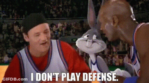 Bugs Bunny Is Talking To A Man On A Basketball Court And Says `` I Do N't Play Defense '' . GIF