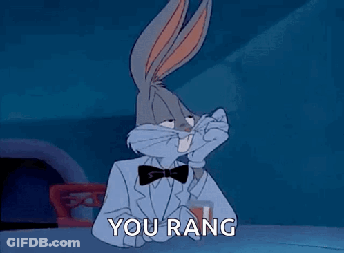 Bugs Bunny Is Wearing A Tuxedo And Bow Tie And Holding A Glass Of Wine . GIF