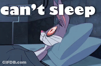 Bugs Bunny Laying In Bed Can't Sleep GIF