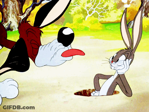 Bugs Bunny Laying On Ground With Tongue Out GIF