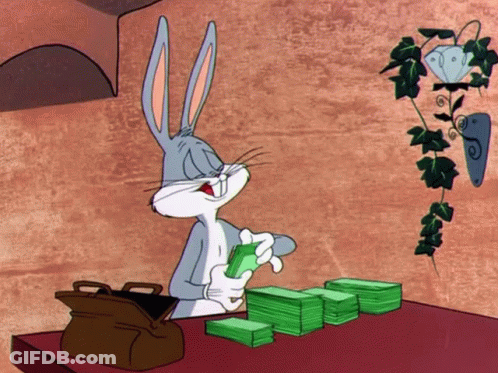 Bugs Bunny Sitting At Table With Stack Of Money GIF
