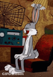 Bugs Bunny Sitting In Chair With Open Mouth GIF